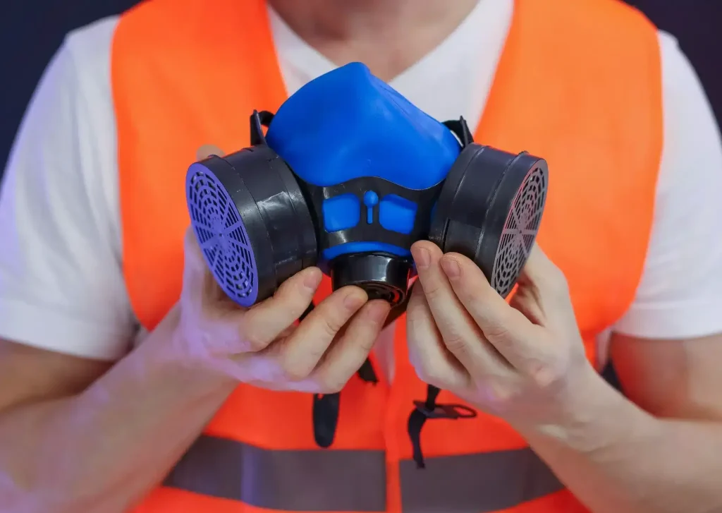 A worker carrying out face fit check on RPE