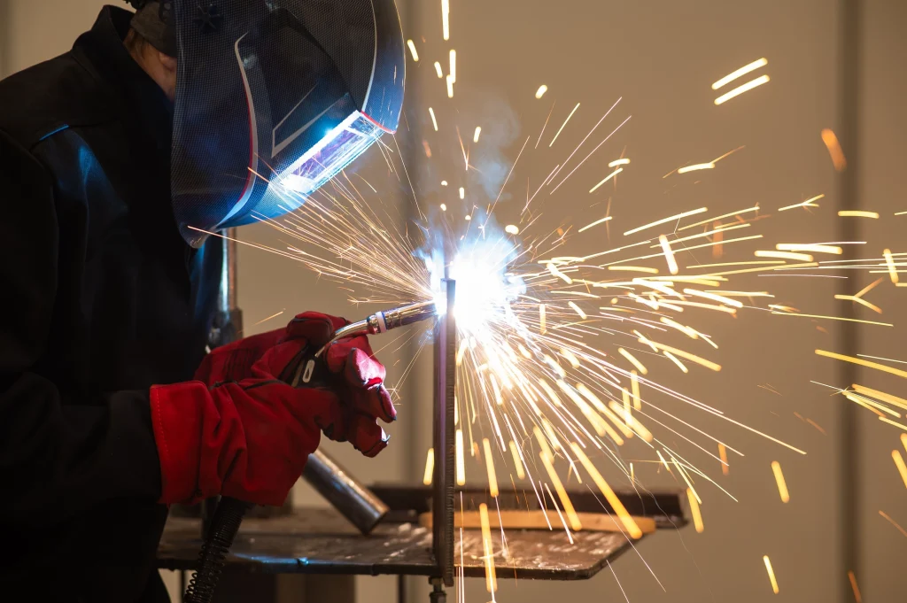 A worker carrying out hot work safely